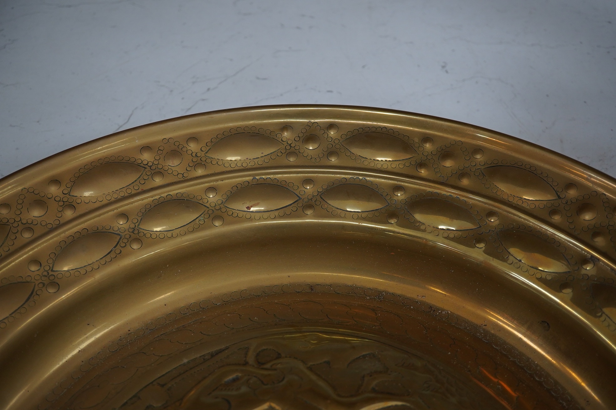 An 18th century German ‘Adam and Eve’ brass alms dish, 52cm diameter. Condition - good